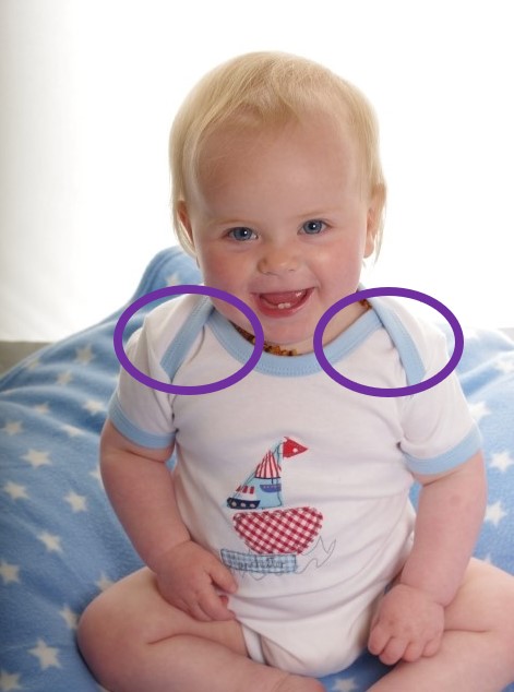 Baby onesie vest bodysuit with overlaping shoulder flaps for easy dressing. www.parsnipandbramble.co.uk